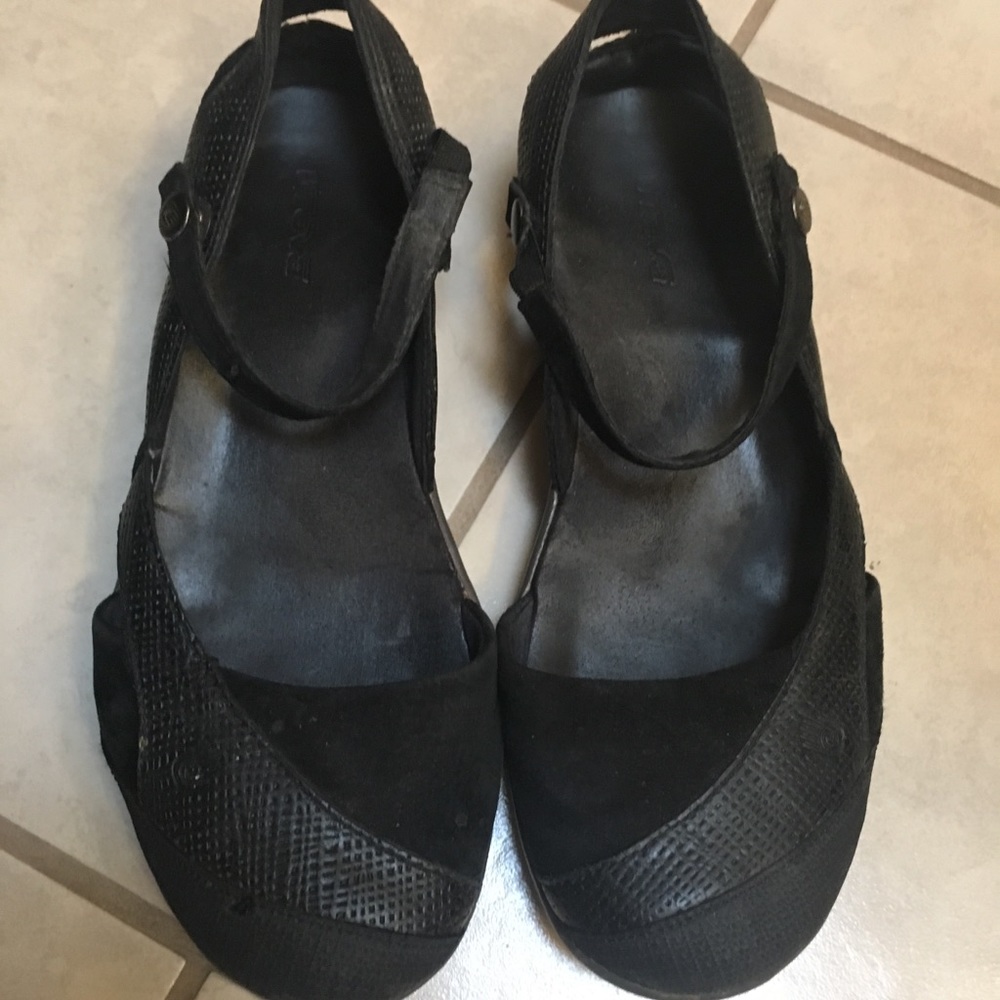 Black Teva shoes.